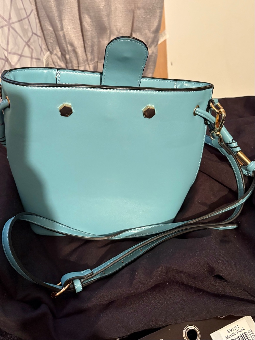 Stylish Aqua Crossbody Bag with Gold Hardware